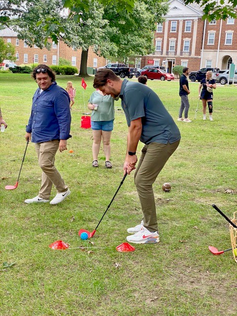 someone playing miniature golf